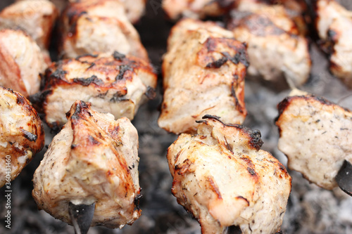 kababs on skewers on the grill closeup