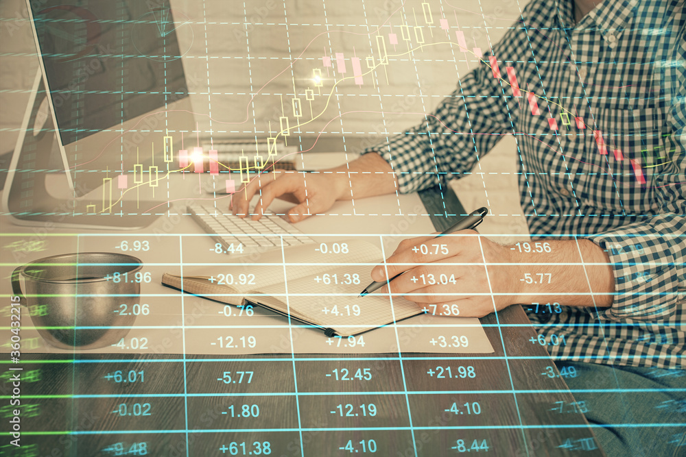 Double exposure of stock market chart with man working on computer on background. Concept of financial analysis. Double exposure of stock market chart with man working on computer on background. Concept of financial analysis.