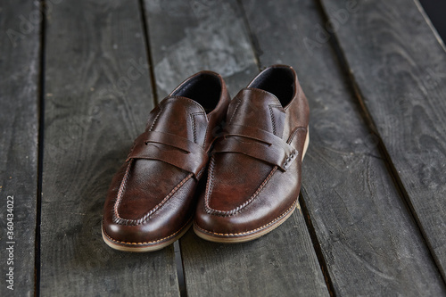 brown loafers on a wooden