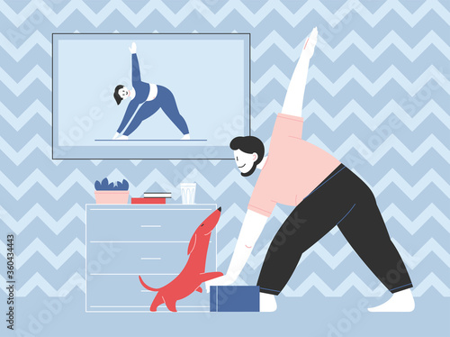 A man practicing yoga at home with a tv lesson