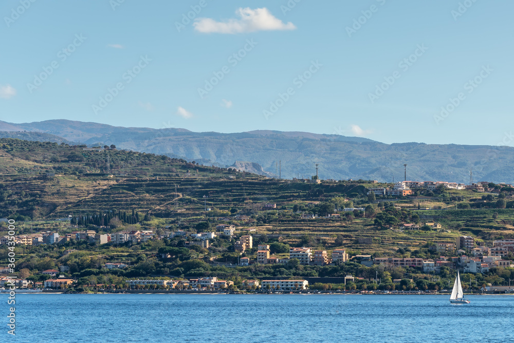 The Strait of Messina is a narrow strait between the eastern tip of Sicily and the western tip of Calabria in the south of Italy. It connects the Tyrrhenian Sea to with the Ionian Sea.