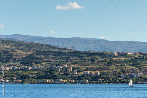 The Strait of Messina is a narrow strait between the eastern tip of Sicily and the western tip of Calabria in the south of Italy. It connects the Tyrrhenian Sea to with the Ionian Sea.