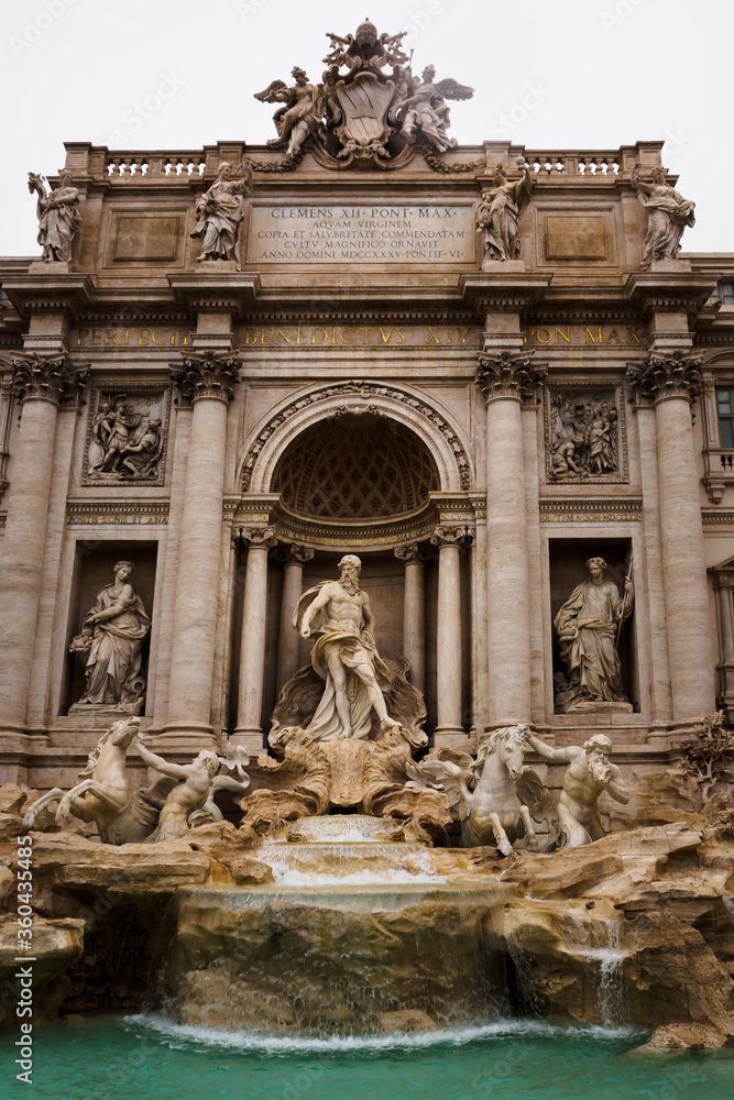 Facade of the Trevi Fountain with the statue of Neptune in Rome