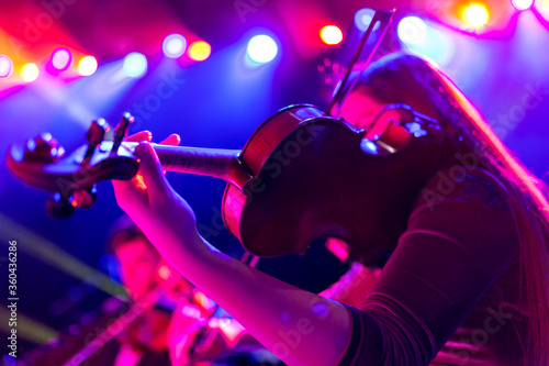 Woman playing the violin during a concert