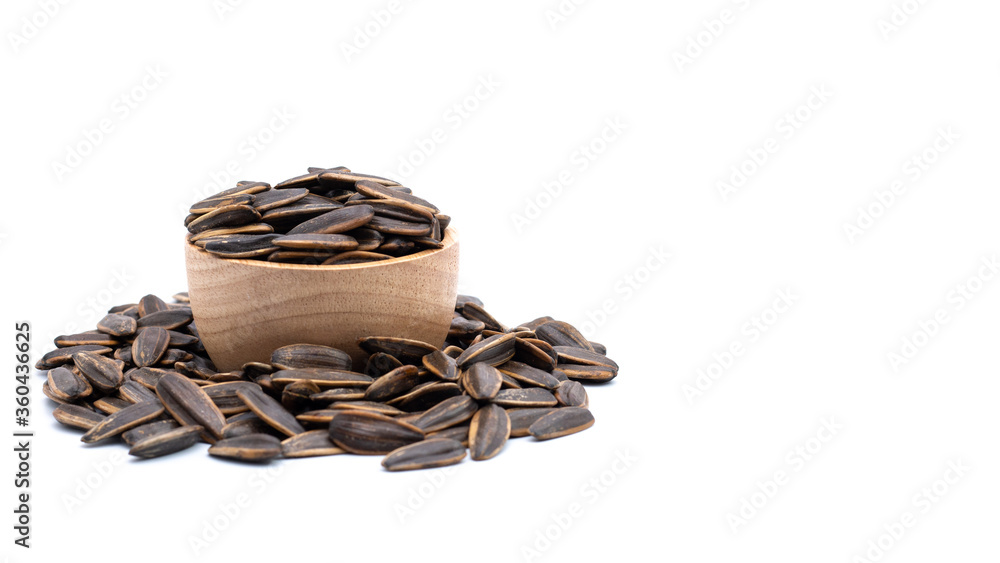 dry sunflower seed in a bowl isolated on white dry sunflower seed in a bowl isolated on white