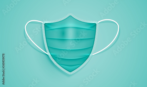 Realistic shield-shaped medical mask on a green background, vector illustration