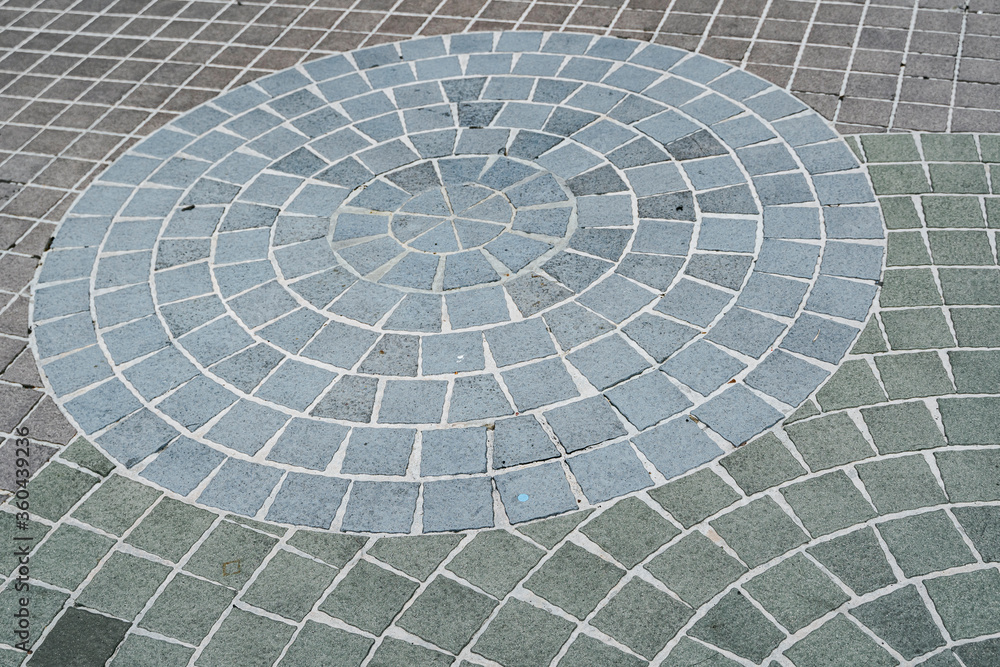 Center view of patio pavers circle design overhead view. Showing well detail cutted edges to match to the circle design Center view of patio pavers circle design overhead view. Showing well detail cutted edges to match to the circle design
