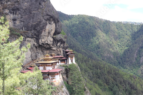 A temple built on a high cliff near the rocky mountains