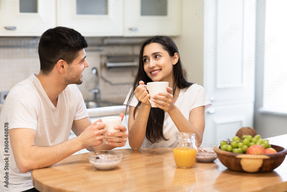 Lovely family enjoying breakfast together at their home Lovely family enjoying breakfast together at their home