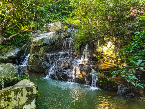 Waterfall and mountaina river in the Yanoda park, Hainan