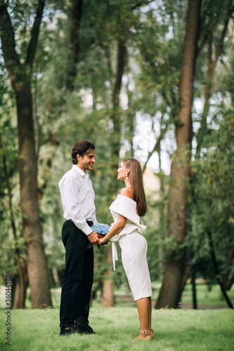 Wedding Couple Saying Marriage Vows During Ceremony In Park, Vertical © Prostock-studio