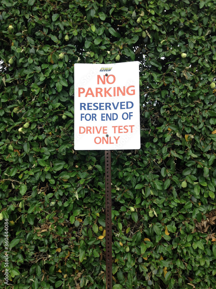 Department of motor vehicles DMV motorcycle auto car driving test exam area no parking reserved sign