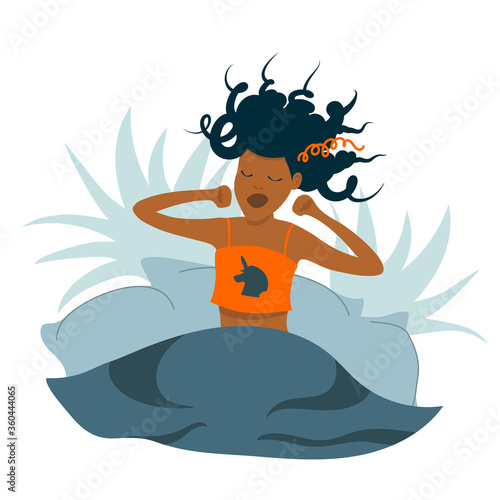 black woman yawning and stretching in bed