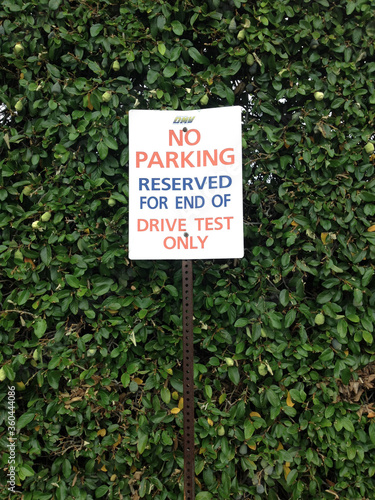 Department of motor vehicles DMV motorcycle auto car driving test exam area no parking reserved sign