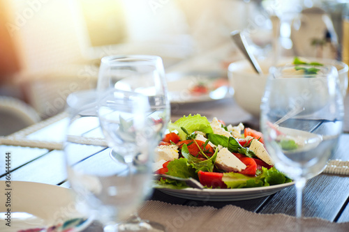 Serving of vegetable salad with cheese on the table