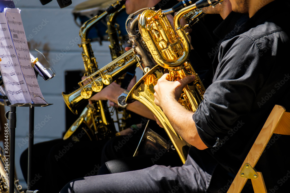 Naklejka premium musical band playing instruments outdoors
