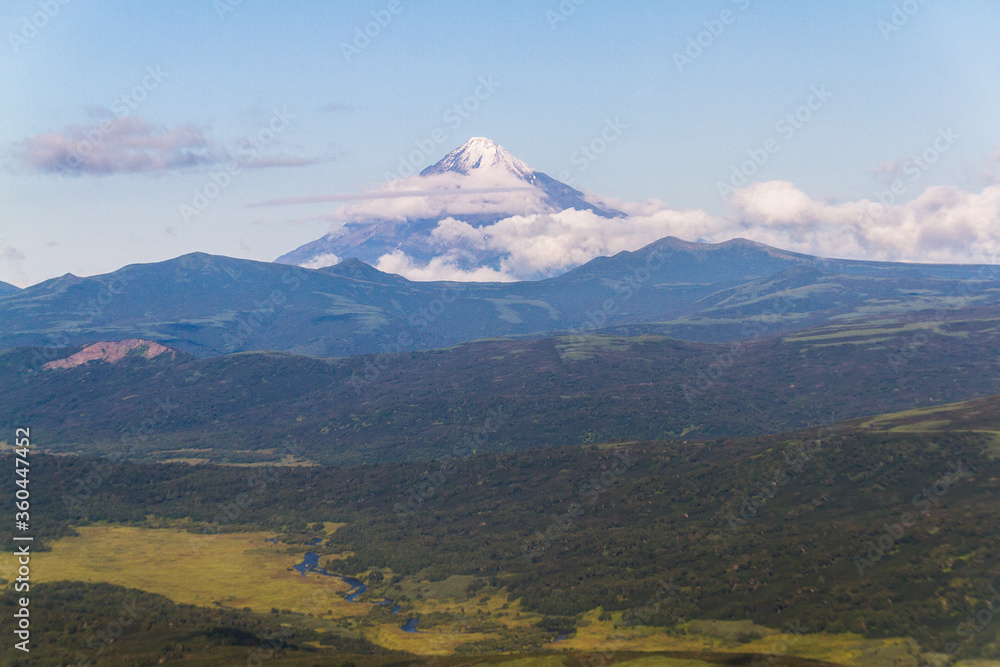 Daytime view in clear sunny weather of hills, rivers, mountains, forests, mountainous terrain.
