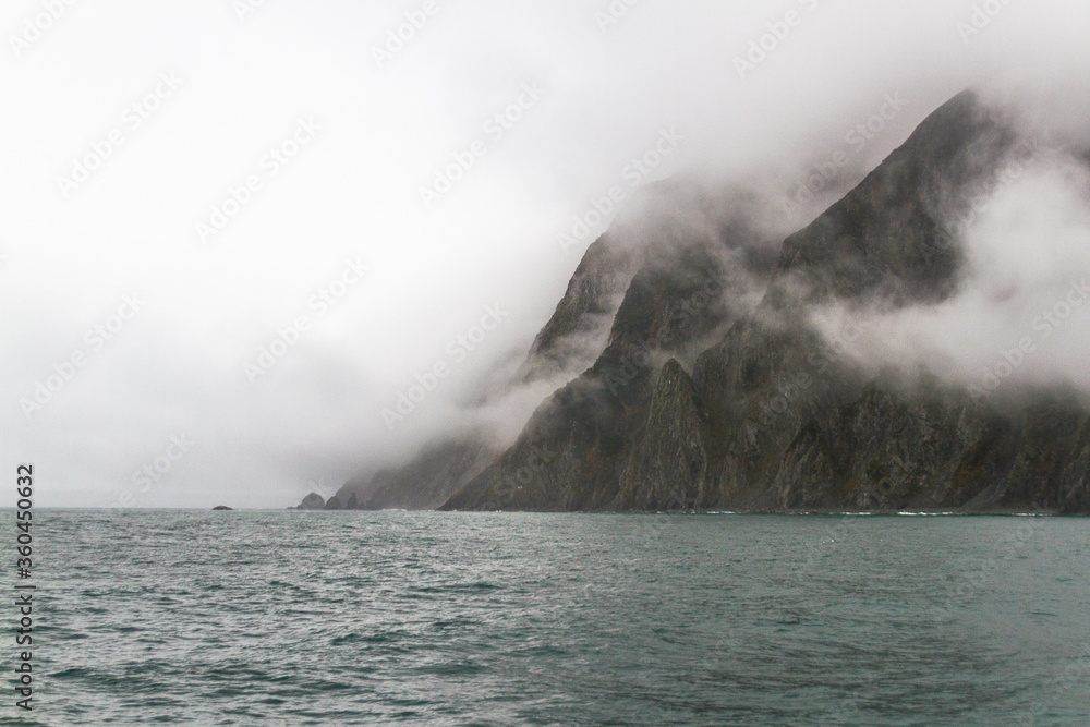 Obraz premium View of the sea bay during bad weather, fog, rain, strong wind