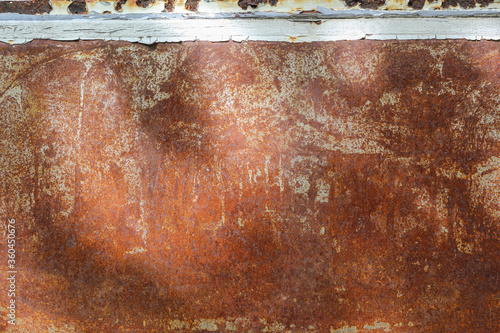 Blurred crack, peeling paint or rust on a car texture background