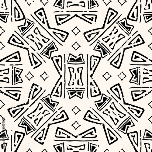Abstract aztec seamless vector pattern background. Backdrop of black and white hand drawn shapes.With grunge texture for an aged look. Geometric ethnic repeat for environment friendly packaging
