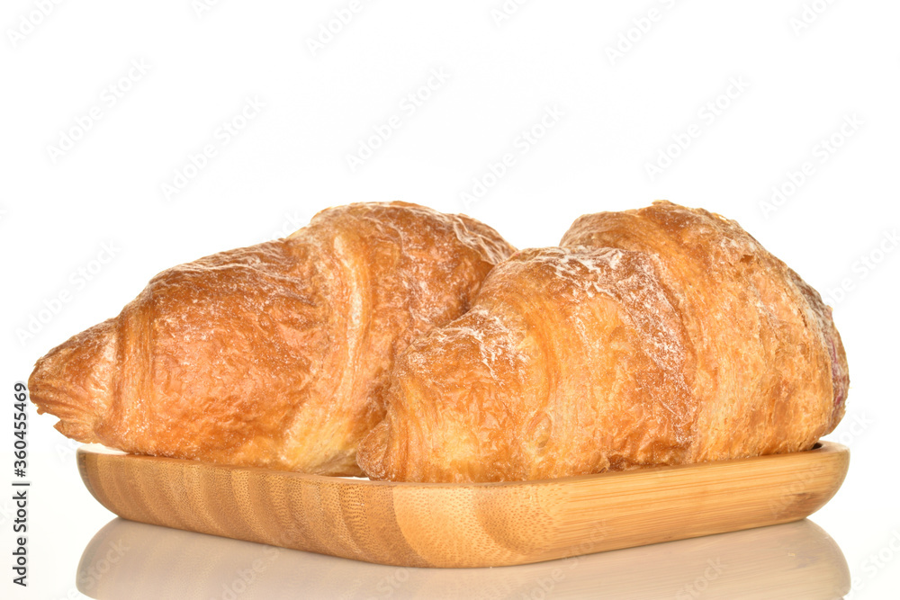 Homemade croissants, close-up, on a white background.