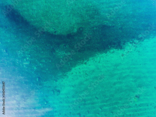 Fototapeta Naklejka Na Ścianę i Meble -  Blue sea water texture aerial drone view, water surface shot from drone, Norway, Finnmark