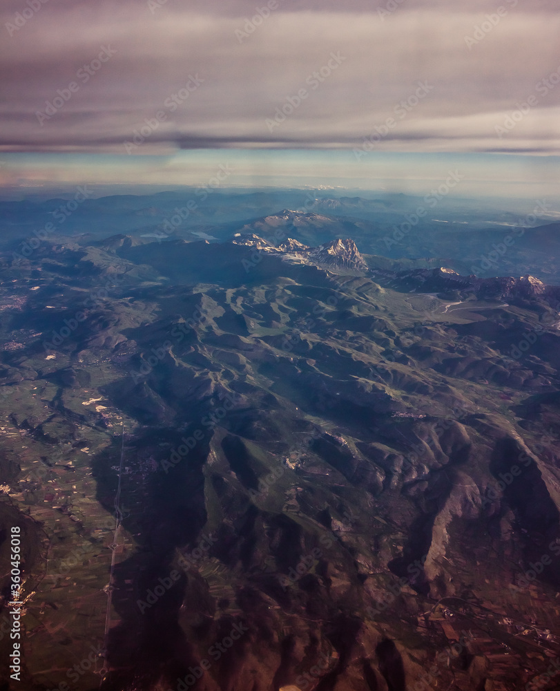 mountains seen from above along with several nearby cities