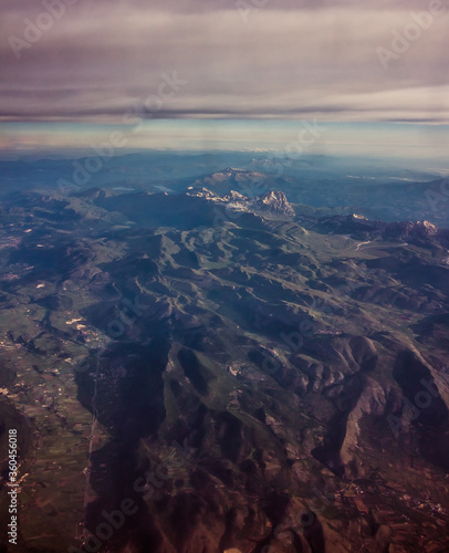 mountains seen from above along with several nearby cities