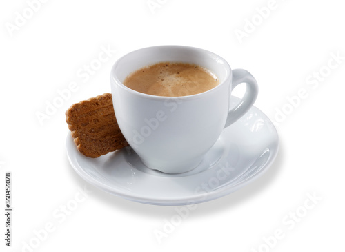 Angled view of a white expresso cup and saucer full of smooth expresso coffee  with a biscuit  isolated on white with