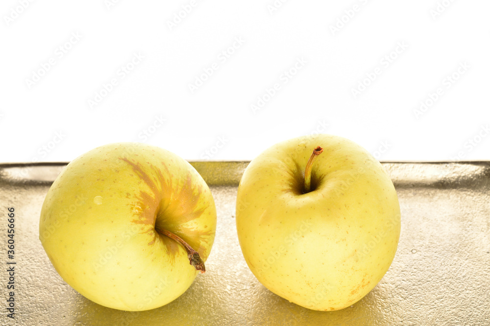 Yellow apples, close-up, on a white background. Yellow apples, close-up, on a white background.