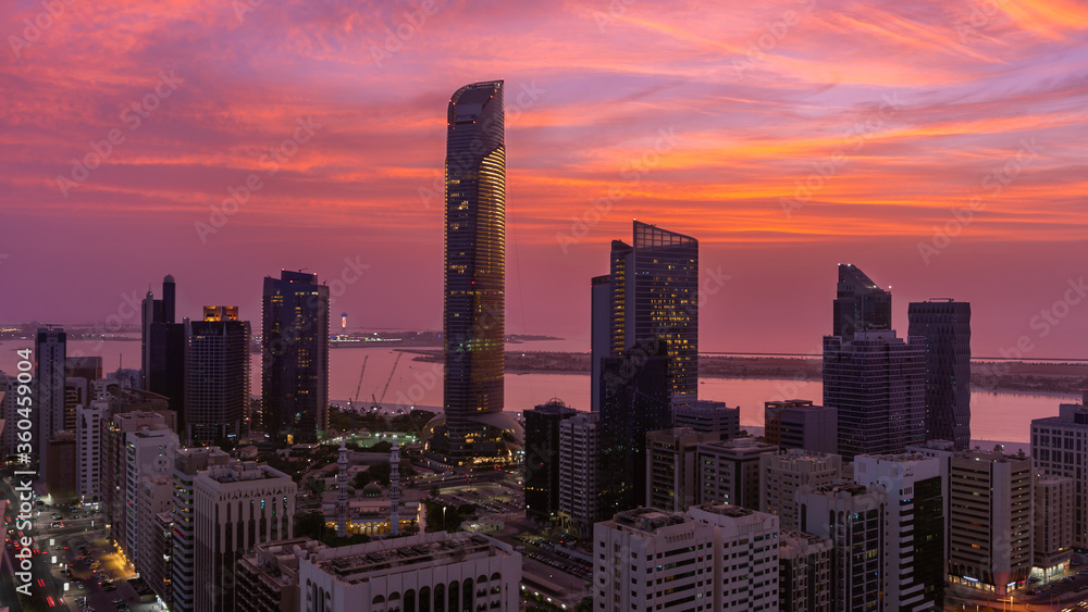 Breathtaking red sunset of Abu Dhabi skyline (United Arab Emirates)