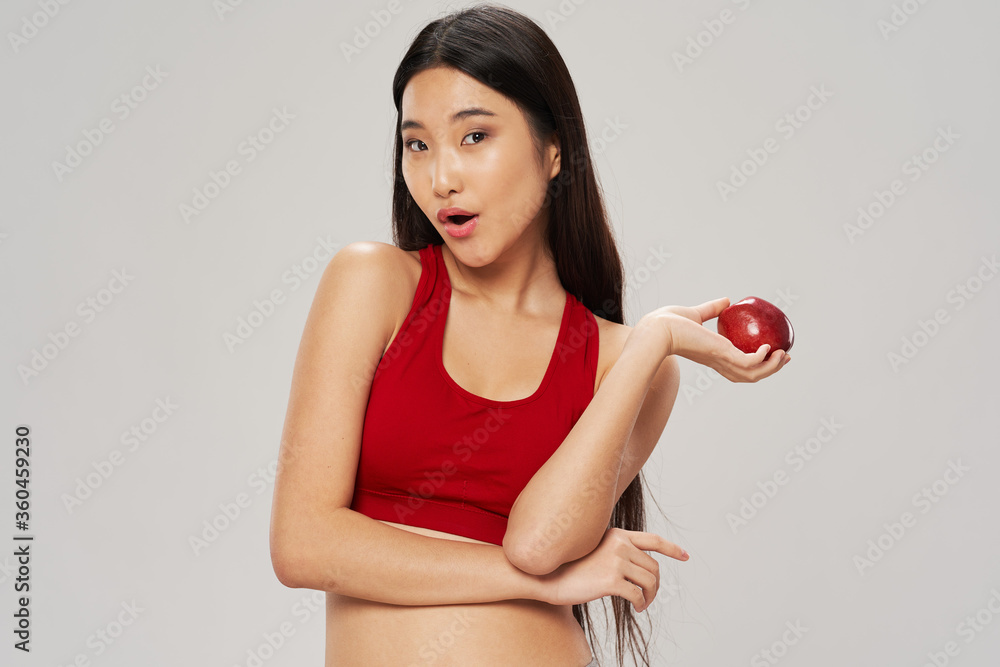 Asian woman athletic body and healthy diet, studio