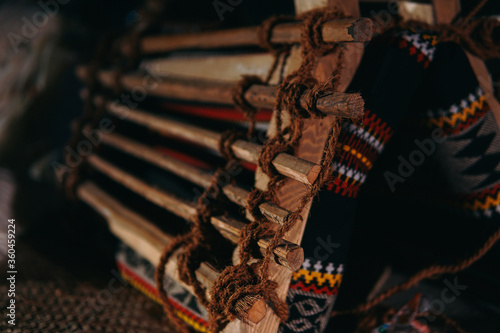 Process of weaving a carpet in old times at the Middle East