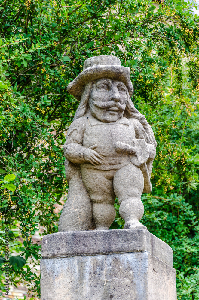 Statue of a male dwarf (carved by workshop of baroque sculptor Matthias Bernard Braun) in the garden of the castle, Nove Mesto nad Metuji, Czech republic