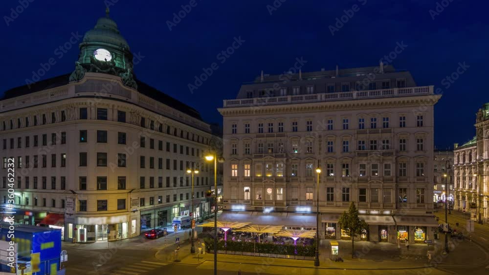 Albertina Square aerial day to night transition timelapse with illuminated historic buildings, tourist buses, people and traffic in downtown Vienna, Austria Albertina Square aerial day to night transition timelapse with illuminated historic buildings, tourist buses, people and traffic in downtown Vienna, Austria