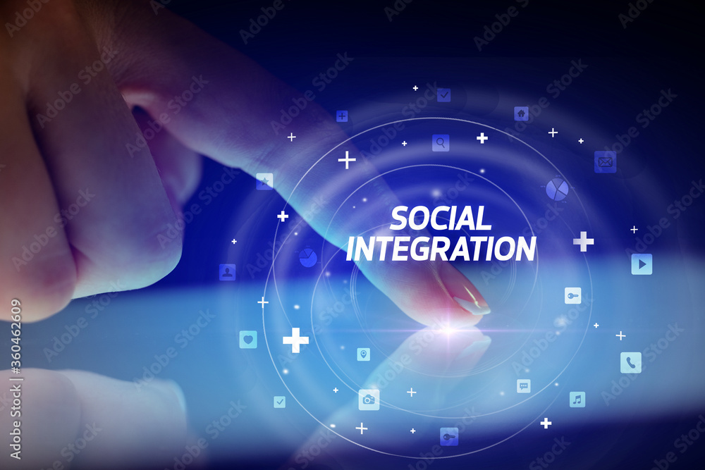 Fototapeta premium Finger touching tablet with social media icons and SOCIAL INTEGRATION