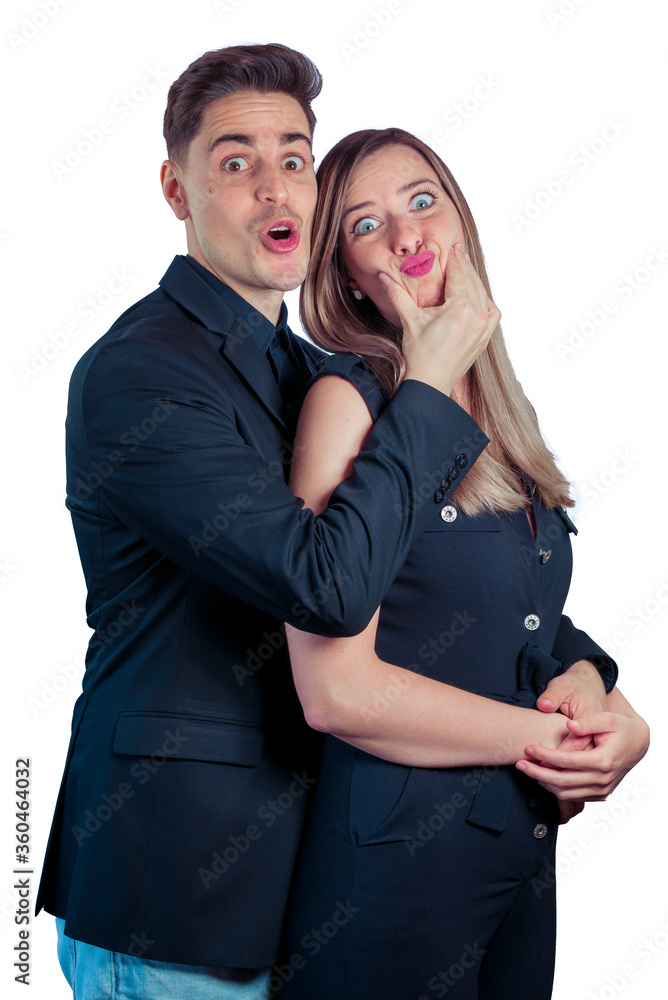 Young couple making funny faces and gestures on a white background Young couple making funny faces and gestures on a white background