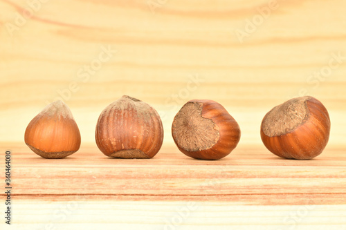 Hazelnuts, macro, on a background of natural wood.