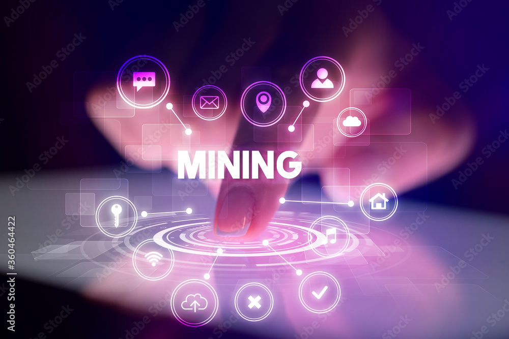 Finger touching tablet with web technology icons and MINING inscription, web technology concept Finger touching tablet with web technology icons and MINING inscription, web technology concept