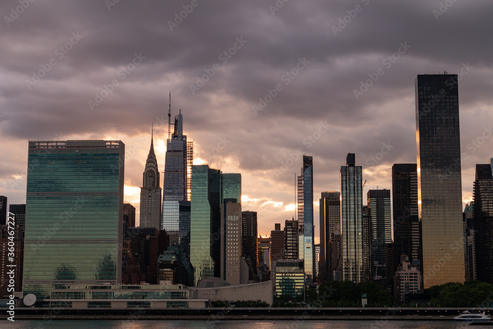Ominous Sky with the Midtown Manhattan Skyline during a Beautiful Sunset along the East River in New York City