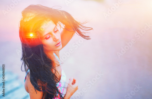 Double exposure portrait of free calm woman outdoors with eyes closed and sun hair on summer beach, nature sunrise or sunset. closeup. Psychology freedom power of mind concept. Deep breath yoga relax. photo