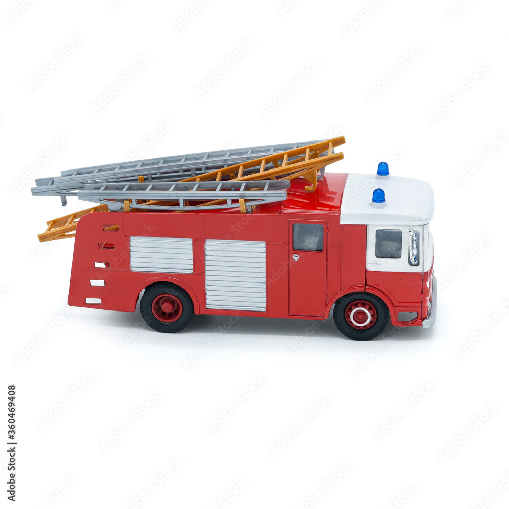 Fototapeta premium Children's toy red fire truck on a white background