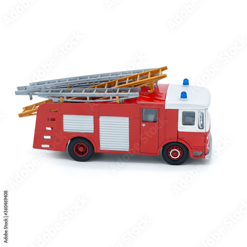 Children's toy red fire truck on a white background