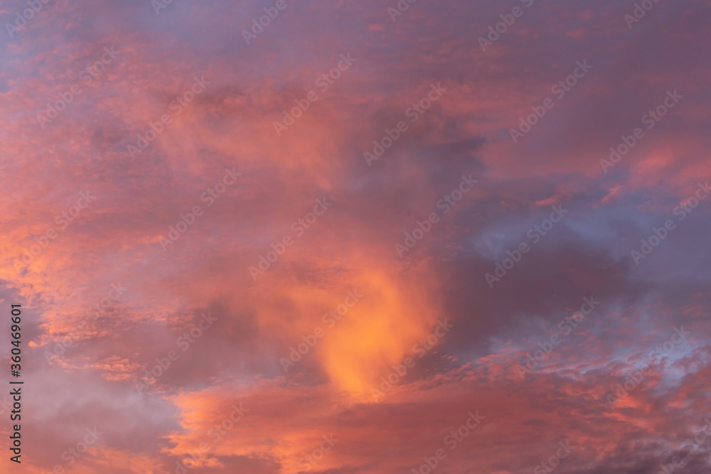Epic dramatic sunrise, sunset pink violet orange sky with storm clouds background texture	