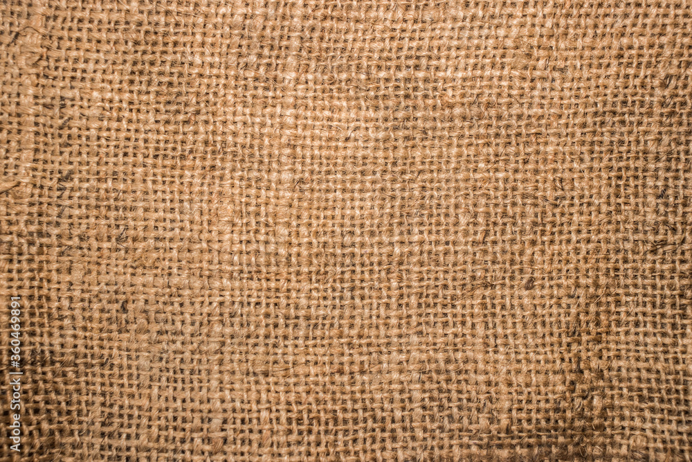 Rough canvas, burlap, sackcloth,сlose up.The canvas is made from various woven materials, such as linen, cotton, jute, polyester, as well as from mixtures of the above materials. Rough canvas, burlap, sackcloth,сlose up.The canvas is made from various woven materials, such as linen, cotton, jute, polyester, as well as from mixtures of the above materials.