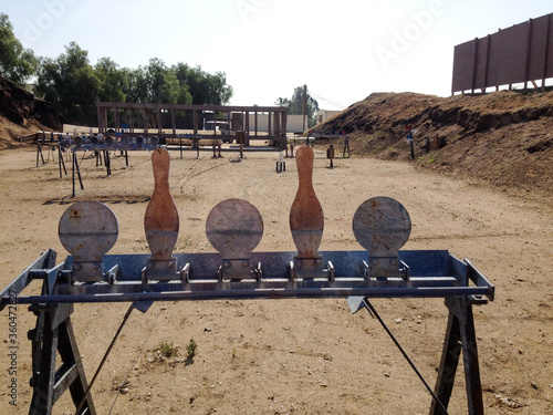 Metal targets at shooting range outdoor firearm rifle shotgun practice sunny
