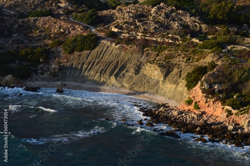 Clay slopes formed by blue clay weathering and erosion by sea at Fomm ir-Rih Bay, Malta photo