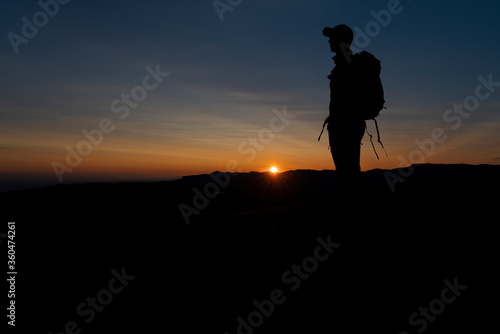 A silhouette in the midnight sun of Greenland