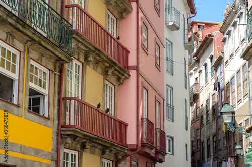 Historic old city buildings facades and with clean laundry on balconies, Porto, Portugal