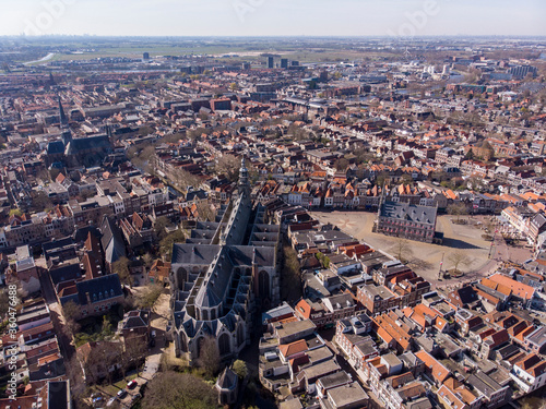 Aerial drone Photo of the Dutch City Gouda where gouda cheese is made. City center with lots of historical buildings and churches including the city hall and the cheese market